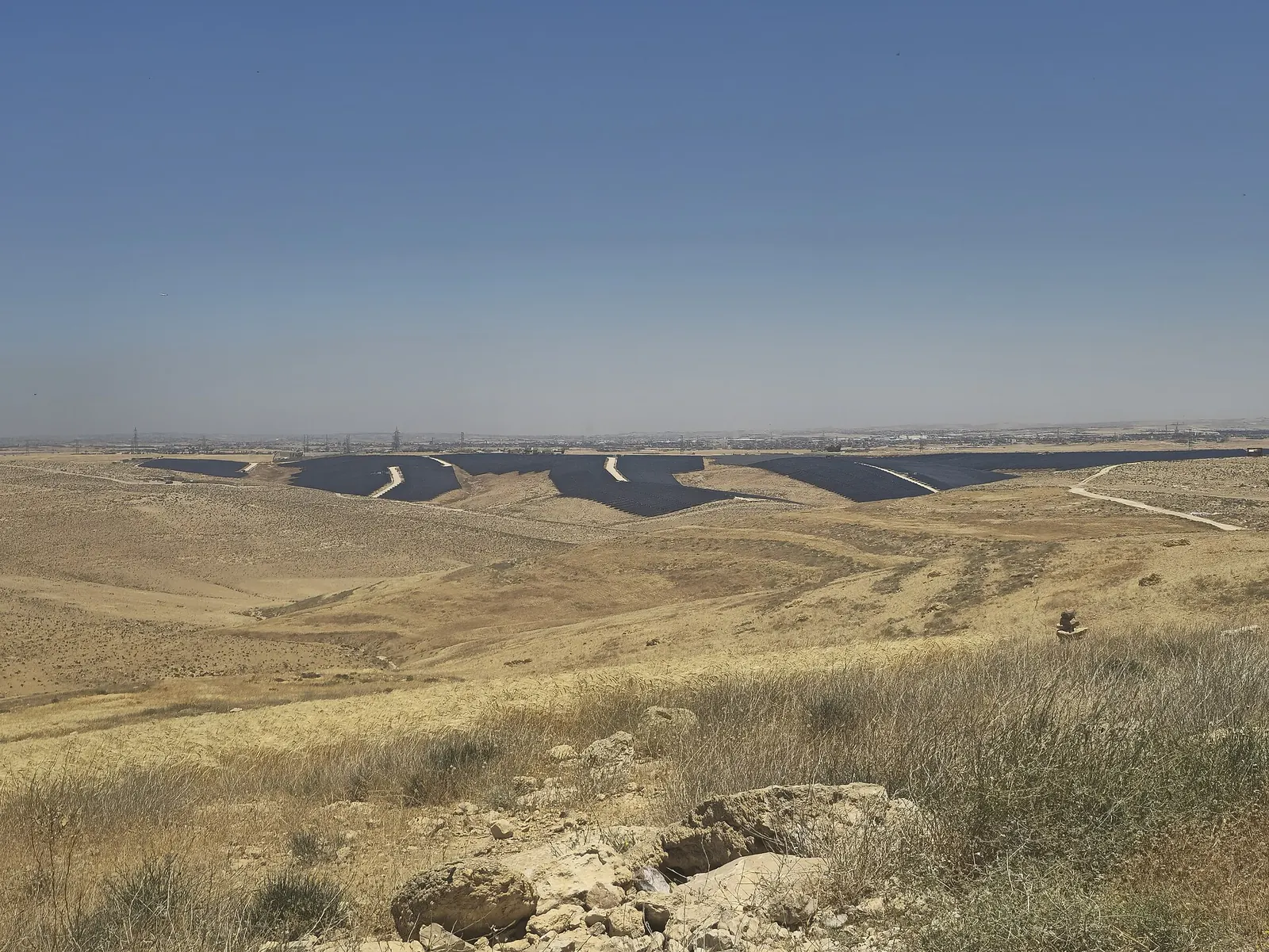 Rows of solar panels across the hills at the South Amman solar power plant
