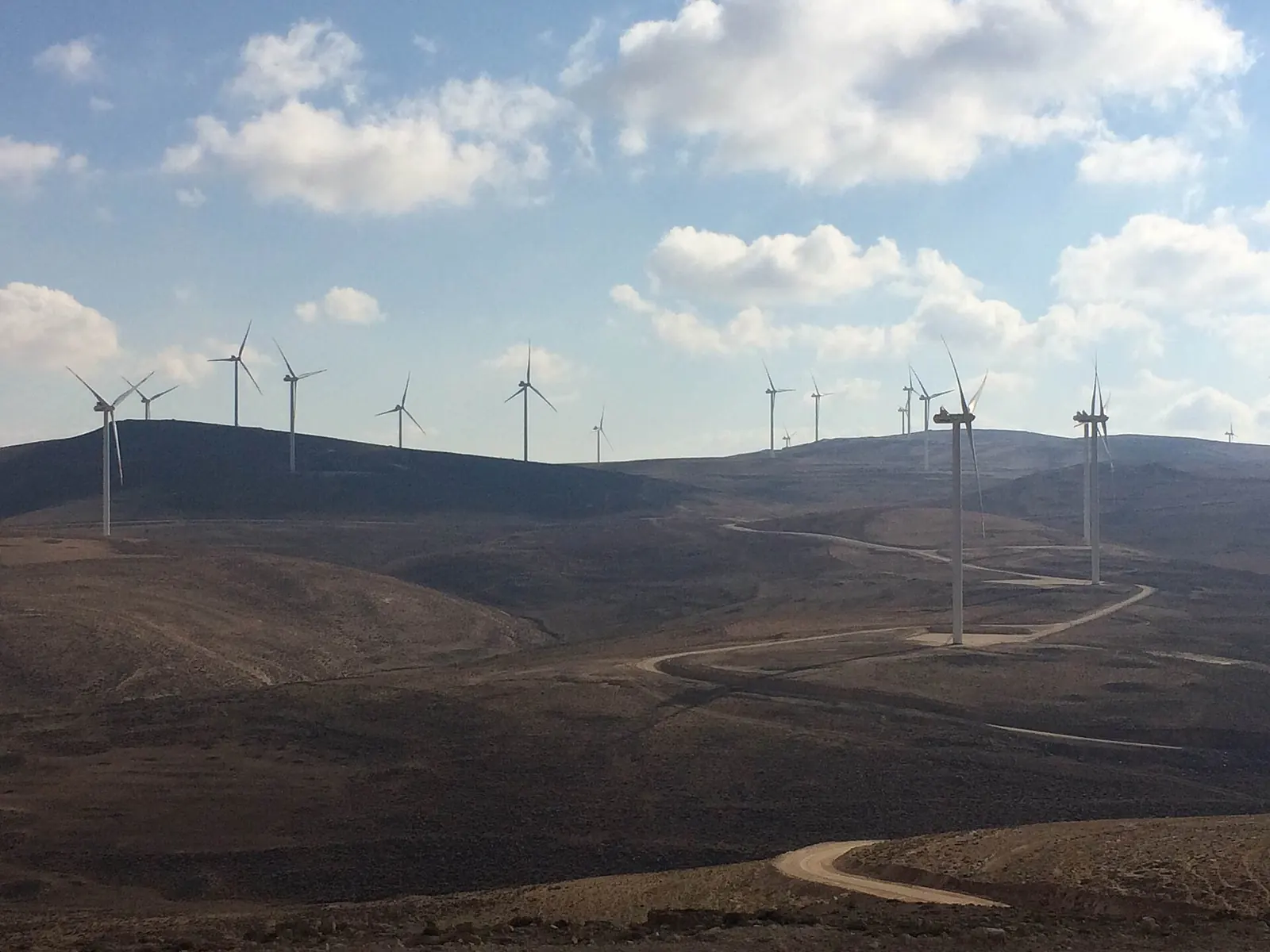 Wind turbines along the ridges of the Tafila wind farm in southern Jordan